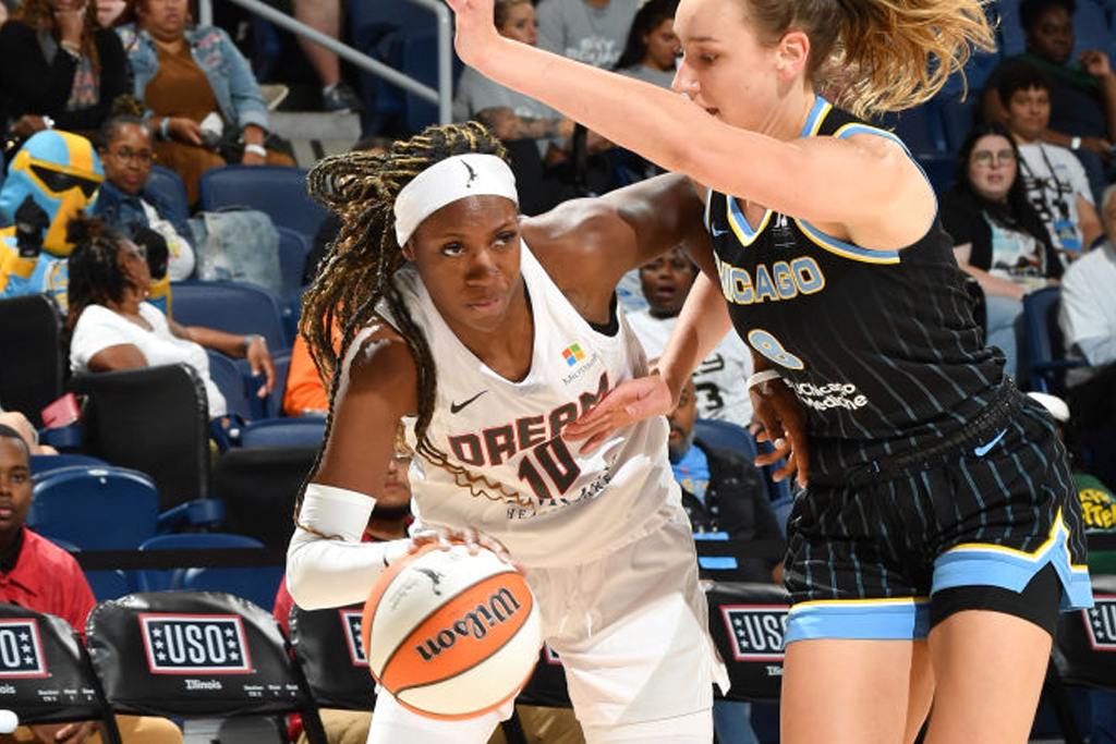 Rhyne Howard #10 of the Atlanta Dream dribbles the ball during the game against the Chicago Sky on July 9, 2023